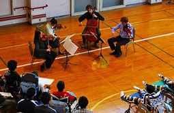 A quartet of Midori and young musicians