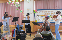 A quartet of Midori and young musicians